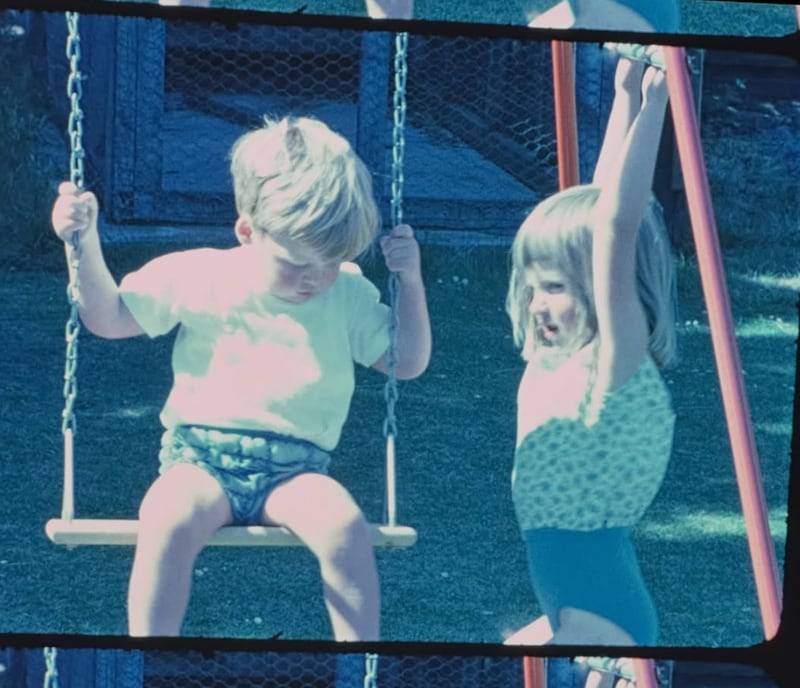 Charles and Diana Spencer play on a swing set in a 1966 throwback photo.