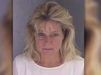 Teresa Jo Burchfield, wife of a lawyer in charge of overseeing ethics in President Trump’s business trust was arrested outside a Virginia jail—with an inmate in her backseat.
