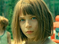Photo still of a child in 'Riddle of Fire'