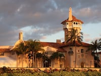 PALM BEACH, FLORIDA - MARCH 21: A Secret Service agent guards the Mar-a-Lago home of former President Donald Trump on March 21, 2023 in Palm Beach, Florida. (Photo by Joe Raedle/Getty Images)
