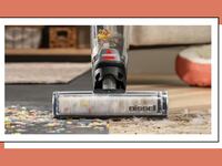 BISSELL CrossWave® OmniForce™ vacuuming cereal.