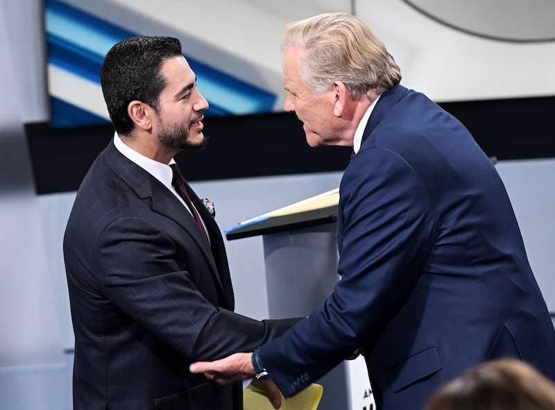 SOUTHFIELD, MICHIGAN - OCTOBER 21: U.S. Senate candidates Democrat Abdul El-Sayed, left, and Michigan Republican Senate candidate, former U.S. Rep. Mike Rogers (R-MI) shake hands after the debate on October 21, 2026 at WXYZ Channel 7 in Southfield, Michigan. (Photo by Robin Buckson-Pool/Getty Images)