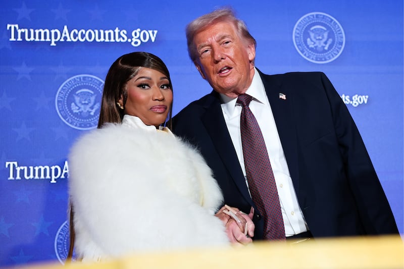Musician Nicki Minaj (L) joins U.S. President Donald Trump on stage