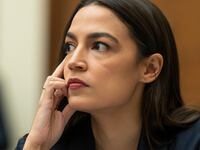 Rep. Alexandria Ocasio-Cortez (D-NY) listens as John J. Ray III, CEO of FTX Group, testifies during the House Financial Services Committee hearing titled Investigating the Collapse of FTX Part I, at the US Capitol on December 13, 2022 in Washington, DC.