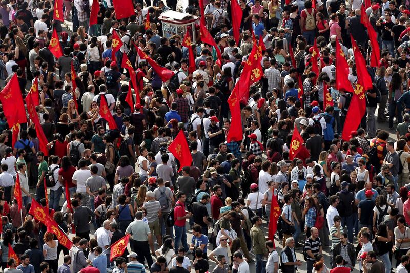 articles/2013/06/02/as-police-cede-taksim-square-istanbul-remains-on-edge/taksin-turkey-square-flags-tease_j7mewa