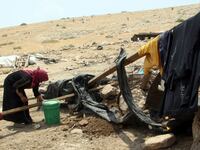 articles/2012/08/09/susya-human-rights/susya-woman-openz_u4pvf7