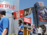 SAG-AFTRA and WGA members walk the picket line