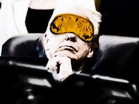 Donald Trump wearing a sleep mask while in a meeting.