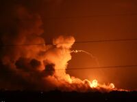Smoke and flames rise during Israeli strikes in the Gaza Strip.
