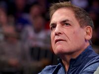 Mark Cuban stares forward at an NBA game.