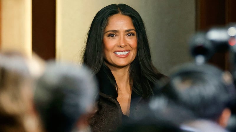 Mexican actress Salma Hayek gestures during a press conference to announce a government incentive scheme for the audiovisual and film industry, in Mexico City, on February 15, 2026. Hayek announced that she is working on a new film aimed at highlighting Mexico's image and responding to the attacks that, she said, have been directed at her country.