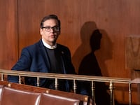 Rep. George Santos walks through the House chamber before the start of the 7th failed attempt to elect a speaker in the Capitol on Thursday, January 5, 2023.