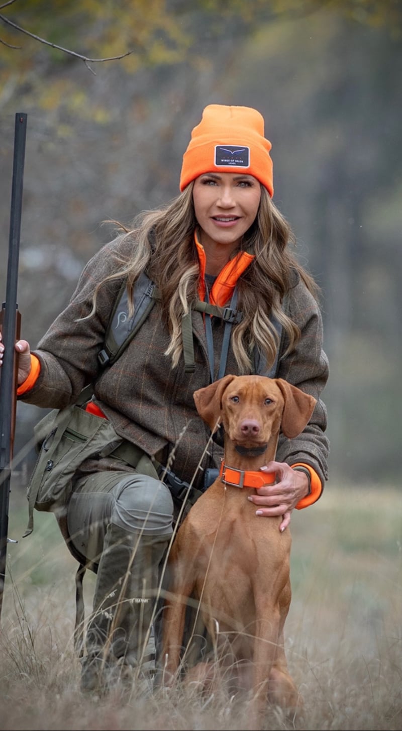 Kristi Noem and her dog, Foster, on a pheasant hunt.