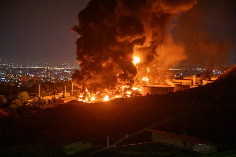 Fire and smoke rise into the sky after an Israeli attack on the Shahran oil depot in Tehran, Iran.