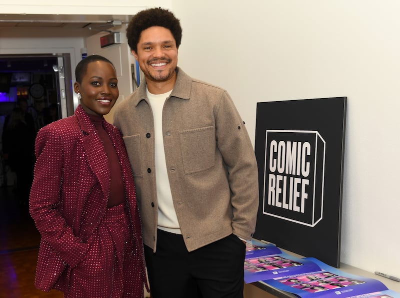 NEW YORK, NEW YORK - DECEMBER 10: (L-R) Lupita Nyong'o and Trevor Noah attend the Comic Relief Live 2025: A Benefit to Build Brighter Futures for Kids at Carnegie Hall on December 10, 2025 in New York City.