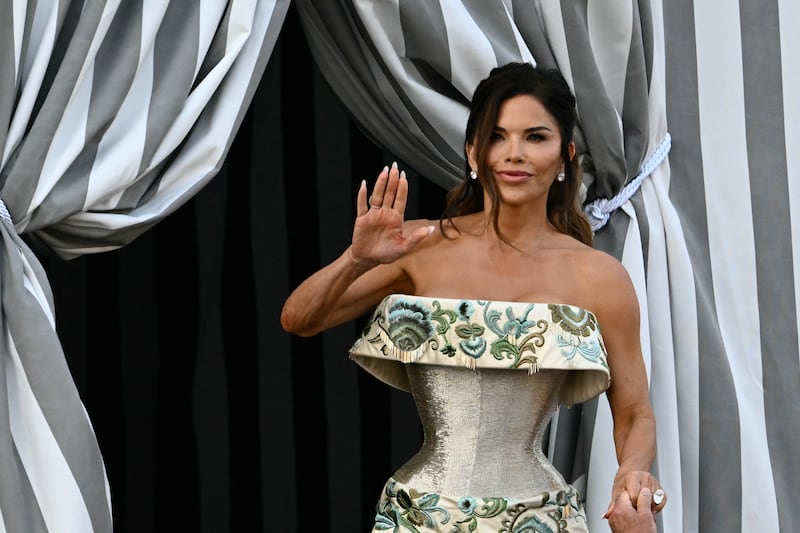 Lauren Sanchez waves as she boards a taxi boat at the Aman Hotel in Venice on June 26, 2025.