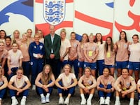 Britain's Prince William, President of The Football Association, poses with the England Women's team before the Women's World Cup.