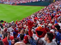 Phillies fans pack into the stands for a playoff baseball game.