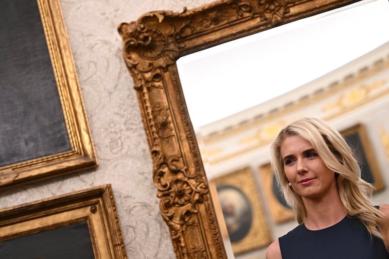 Executive Assistant to the President Natalie Harp listens as President Donald Trump makes an announcement on steel in the Oval Office of the White House in Washington, DC, on September 28, 2026.