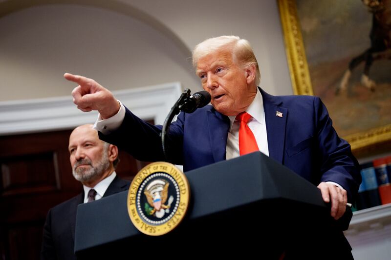 President Donald Trump, accompanied by Commerce Secretary Howard Lutnick, who some say wants to be a "mini Trump."