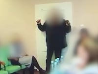 A councilor detonates grenades at a meeting of the Keretsky village council in western Ukraine.