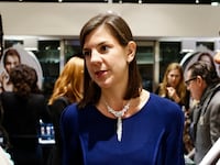 Charlotte Cowles speaking to people at a party.