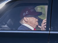 WASHINGTON D.C., UNITED STATES - OCTOBER 30: United States President Donald Trump holds a smartphone during his arrival at the White House in Washington D.C., United States on October 30, 2025. (Photo by Celal Gunes/Anadolu via Getty Images)