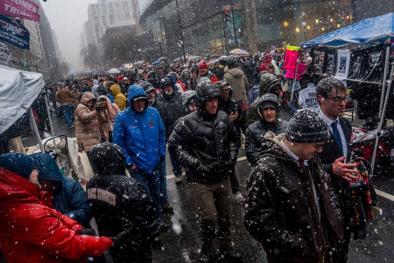 People wait outside Capital One Arena to enter President Donald Trump's Victory Rally.