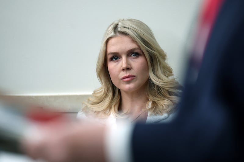 White House Press Secretary Karoline Leavitt listens as U.S. President Donald Trump speaks during a press briefing in the James S. Brady Press Briefing Room of the White House on January 20, 2026 in Washington, DC.