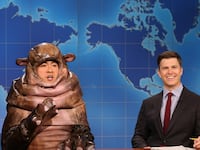 Bowen Yang as Moo Dang the hippo and Colin Jost during Weekend Update on Saturday