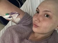 Leah Smith takes a selfie from a hospital bed.