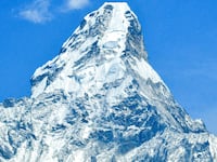This picture taken on April 25, 2021 show Mount Ama Dablam, which peaks at 6,812 meters, in the Everest region, some 140 kilometres northeast of Kathmandu. (Photo by Prakash MATHEMA / AFP) (Photo by PRAKASH MATHEMA/AFP via Getty Images)
