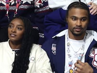MILAN, ITALY - FEBRUARY 13: American gymnast Simone Biles and husband Jonathan Owens in attendance at the Men Single Skating on day seven of the Milano Cortina 2026 Winter Olympic games at Milano Ice Skating Arena on February 13, 2026 in Milan, Italy. (Photo by Andreas Rentz/Getty Images)