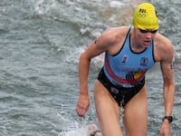 Jolien Vermeylen climbing out of the Seine