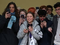 Swedish environmental activist Greta Thunberg (C) fellow defendants and supporters leave Westminster Magistrates Court in London on February 2, 2024, on the second day of their public order offence trial.