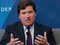 Tucker Carlson pictured speaking at an event.
