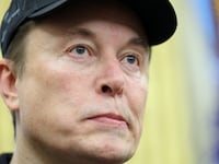 FILE PHOTO: Elon Musk looks on, in the Oval Office of the White House in Washington, D.C., U.S., February 11, 2025. REUTERS/Kevin Lamarque/File Photo