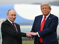 US President Donald Trump shakes hands with Russian President Vladimir Putin on the tarmac after they arrived at Joint Base Elmendorf-Richardson in Anchorage, Alaska, on August 15, 2025. Putin is in Alaska at the invitation of Trump in his first visit to a Western country since he ordered the 2022 invasion of Ukraine that has killed tens of thousands of people. (Photo by ANDREW CABALLERO-REYNOLDS / AFP via Getty Images)