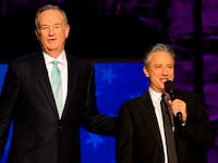 Bill O'Reilly and Jon Stewart onstage together in 2012.
