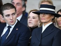 Barron Trump and first lady Melania Trump listen as President Donald Trump gives his inaugural address in the U.S. Capitol Rotunda on January 20, 2025