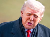 President Donald Trump speaks with reporters on the South Lawn of the White House before boarding Marine One en route to Iowa on Tuesday, January 27, 2026.
