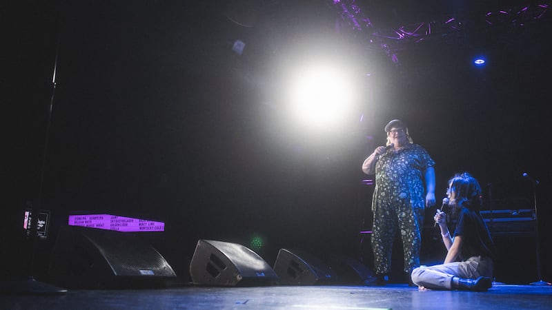 The comedy duo Girl God performs a stand-up show