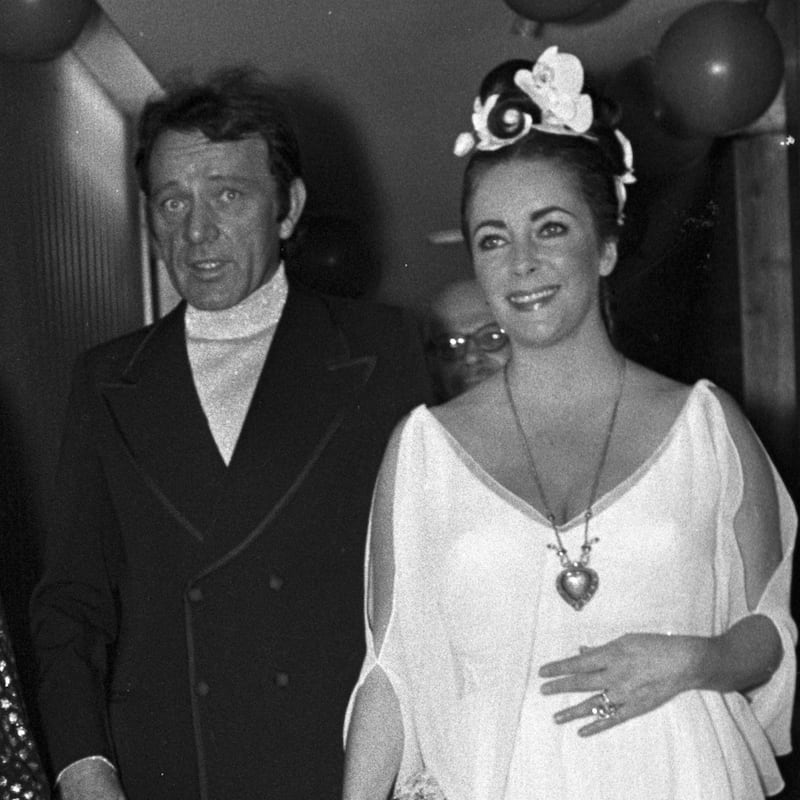 Grace Kelly, Richard Burton, and Elizabeth Taylor celebrate Taylor's fortieth birthday.
Taylor wears the "Taj Mahal" diamond necklace.