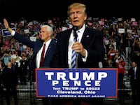 Republican U.S. presidential nominee Donald Trump (R) and vice presidential nominee Mike Pence (L) hold a campaign rally in Cleveland, Ohio, U.S. October 22, 2016.