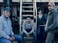 Tommy Lee Jones as Ray, Toby Wallace as Charlie, Jenna Ortega as Mabel and Ben Foster as Tom pose on a boat in a still from ‘Finestkind’