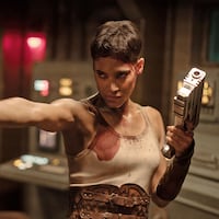 Sofia Boutella holds guns in a stillf rom ‘Rebel Moon Part 2’