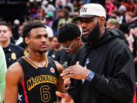 Bronny James, son of LeBron James, suffered a cardiac arrest during basketball practice.