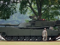 An Army soldier walks near a tank at West Potomac Park in preparation for the Army's 250th Anniversary Parade on June 12, 2025 in Washington, DC, but many Republican lawmakers are not sticking around for the festivities taking place on President Trump's birthday.