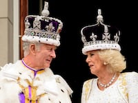 King Charles III and Queen Camilla on the balcony of Buckingham Palace during the Coronation on May 6, 2023.