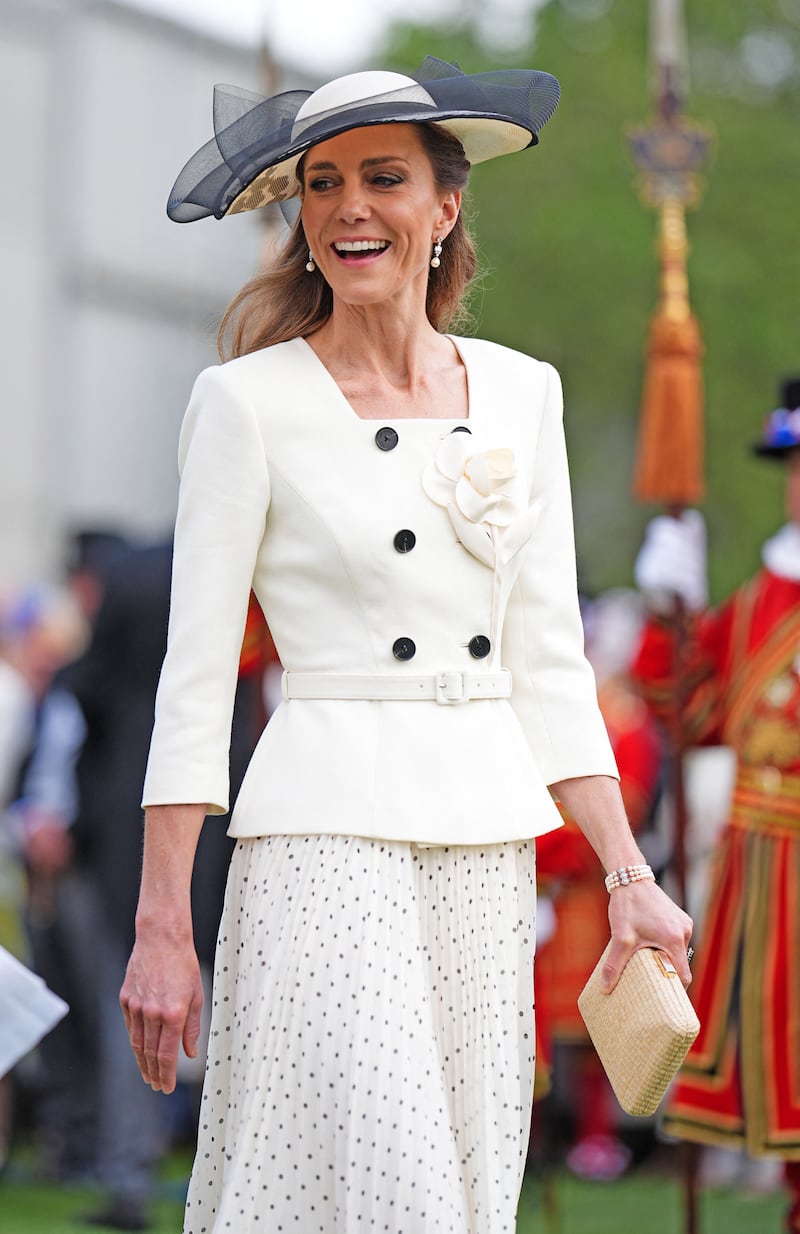 Catherine, Princess of Wales, talks to guests during a Royal Garden Party at Buckingham Palace in 2026.